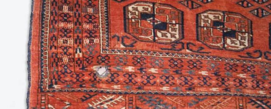 Afghan rug holes repair before Afghan rug holes repair